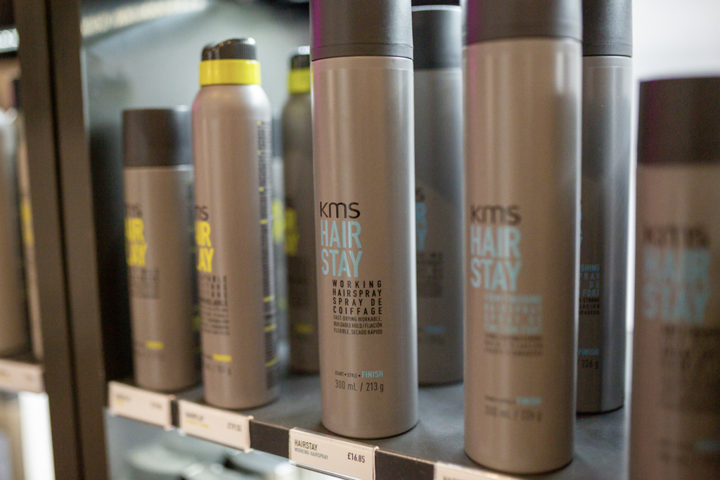 Image of hair salon products with a focus on anti-humidity spray by KMS