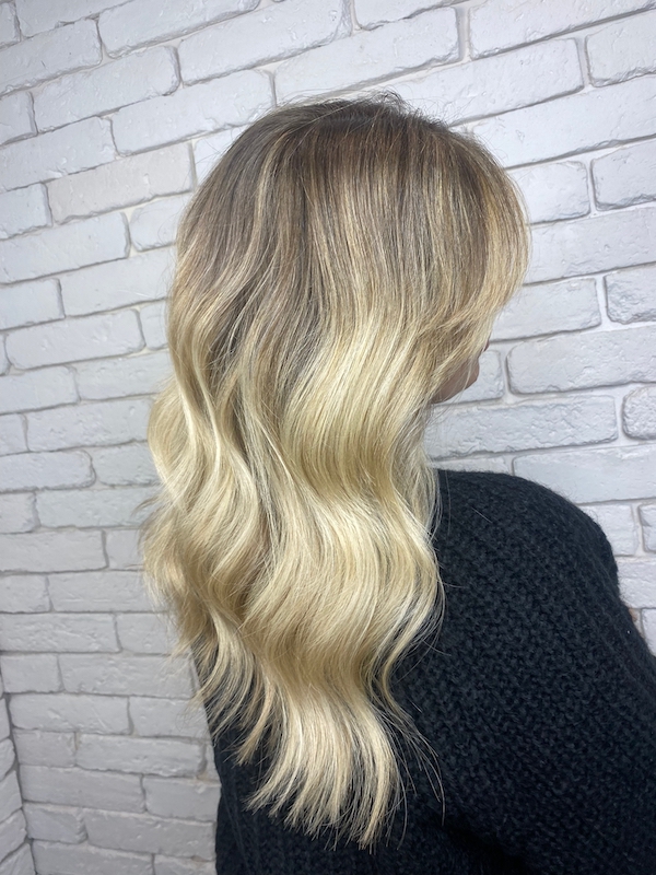 creamy highlighted blond hair with sweeping fringe
